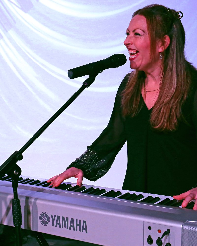 Sarah performing on stage